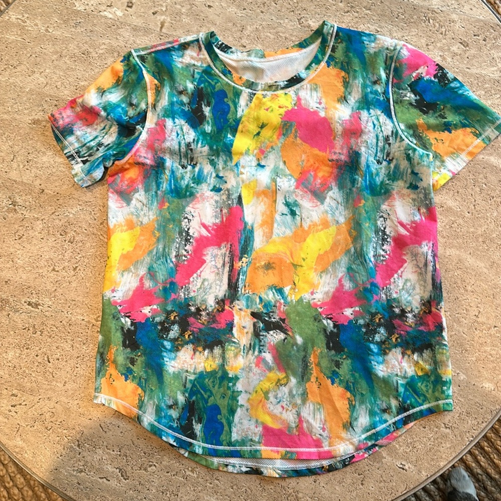 Lululemon size 6 multi colored tshirt- new without tags. Worn and washed once.